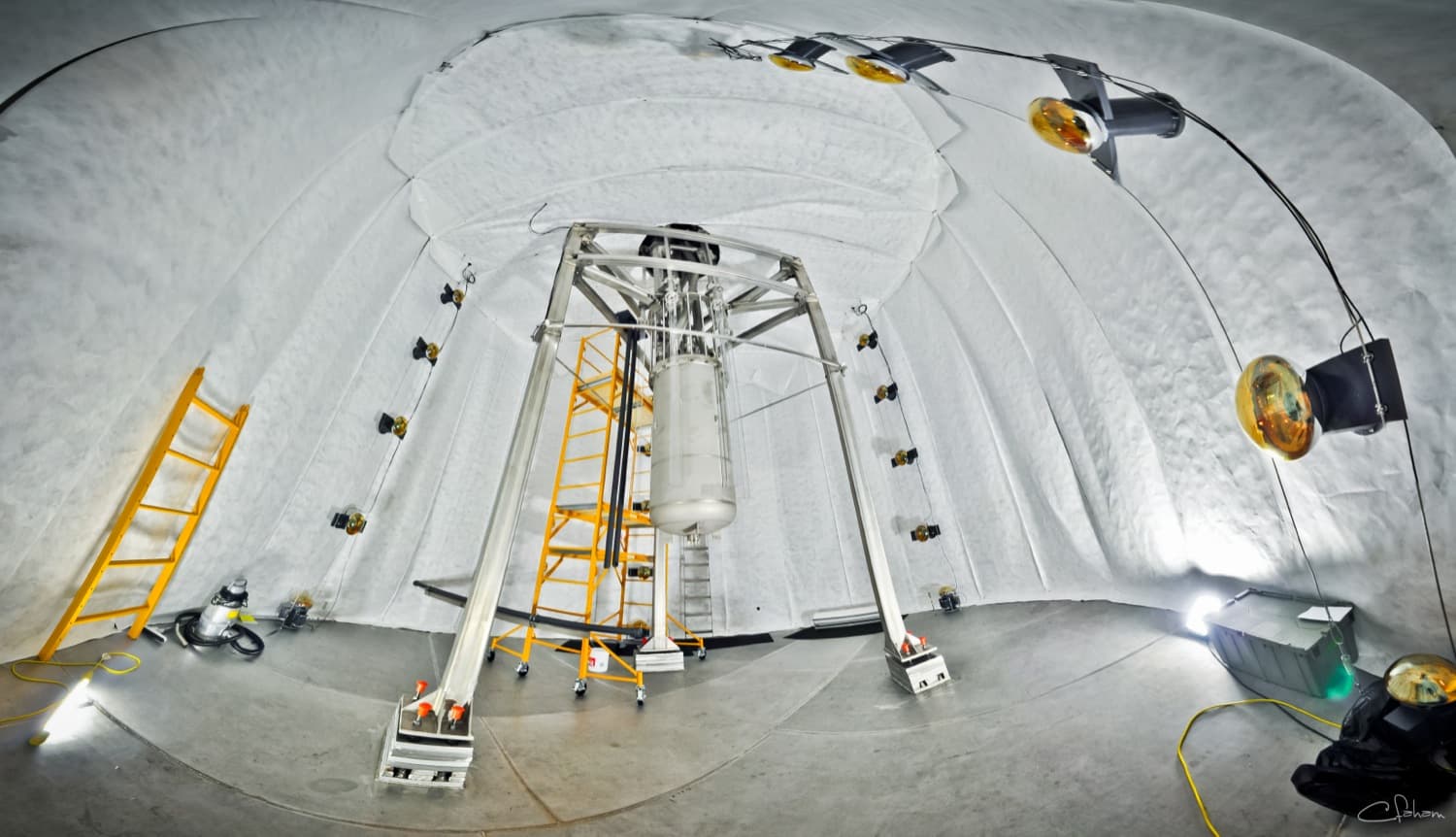 The LUX detector suspended in its 72,000-gallon water shield, 4,850 ft underground. Photo: C.H. Faham, CC BY 3.0, via Wikimedia Commons